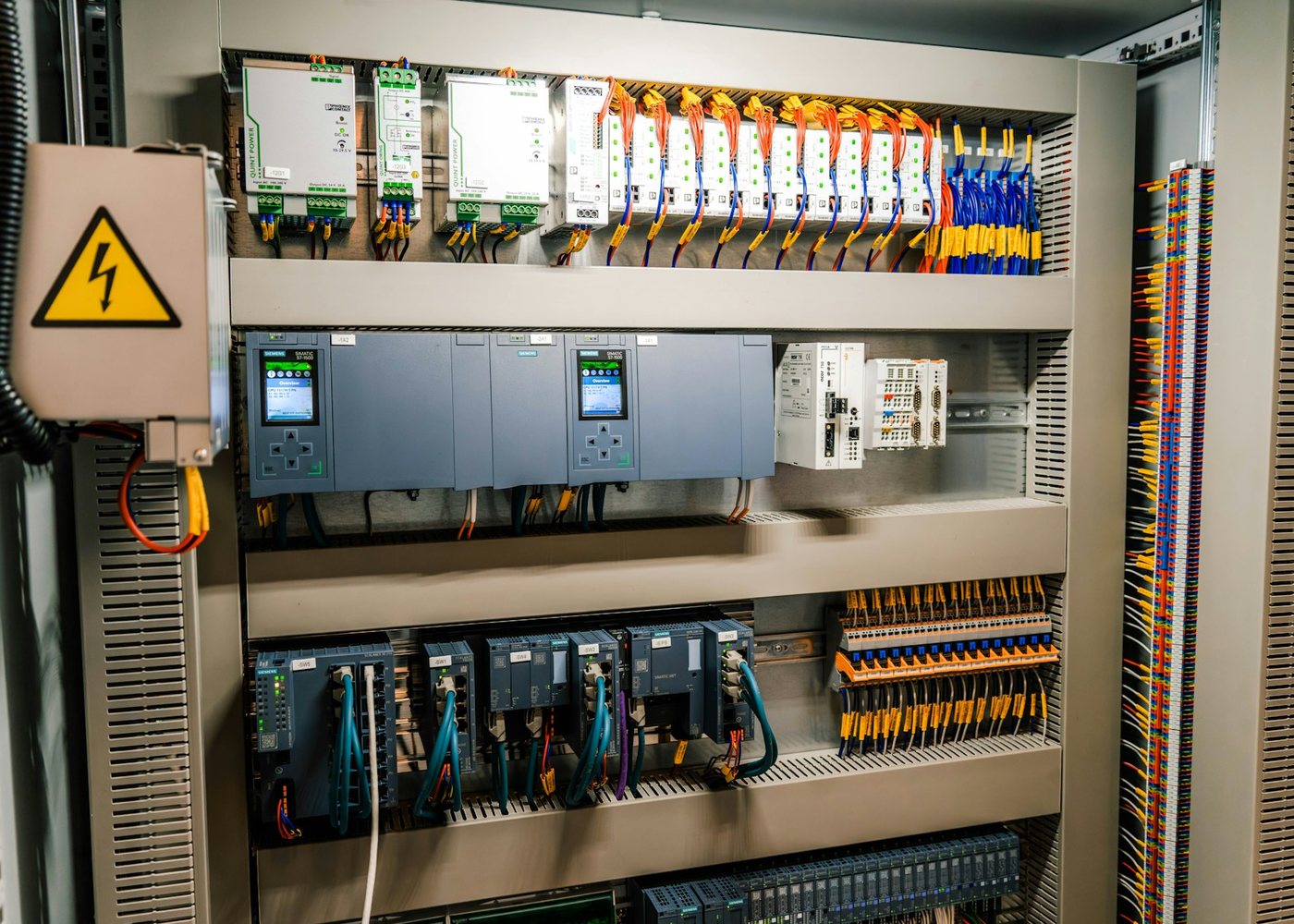 Industrial electrical control panel with breakers and wiring, switchgear sourcing in the UAE